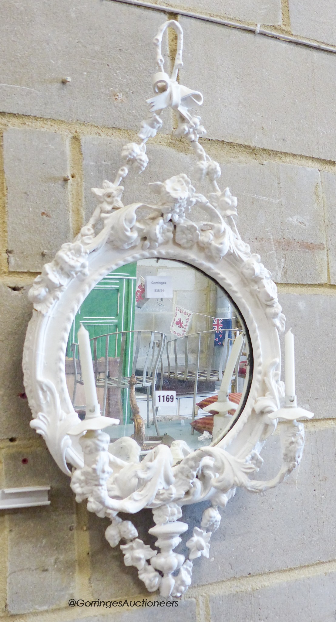 A Victorian later white painted wood and gesso girandole wall mirror, width 40cm, height 81cm together with a painted wall bracket.